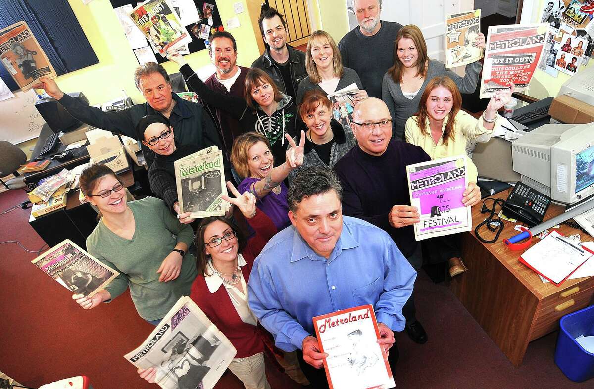 Steve Leon, front center, poses with some members of the Metroland staff as they hold copies of past issues as part of a celebration for their 30th anniversary Tuesday, Feb. 3, 2009, in Albany, N.Y. (Steve Jacobs/Times Union)