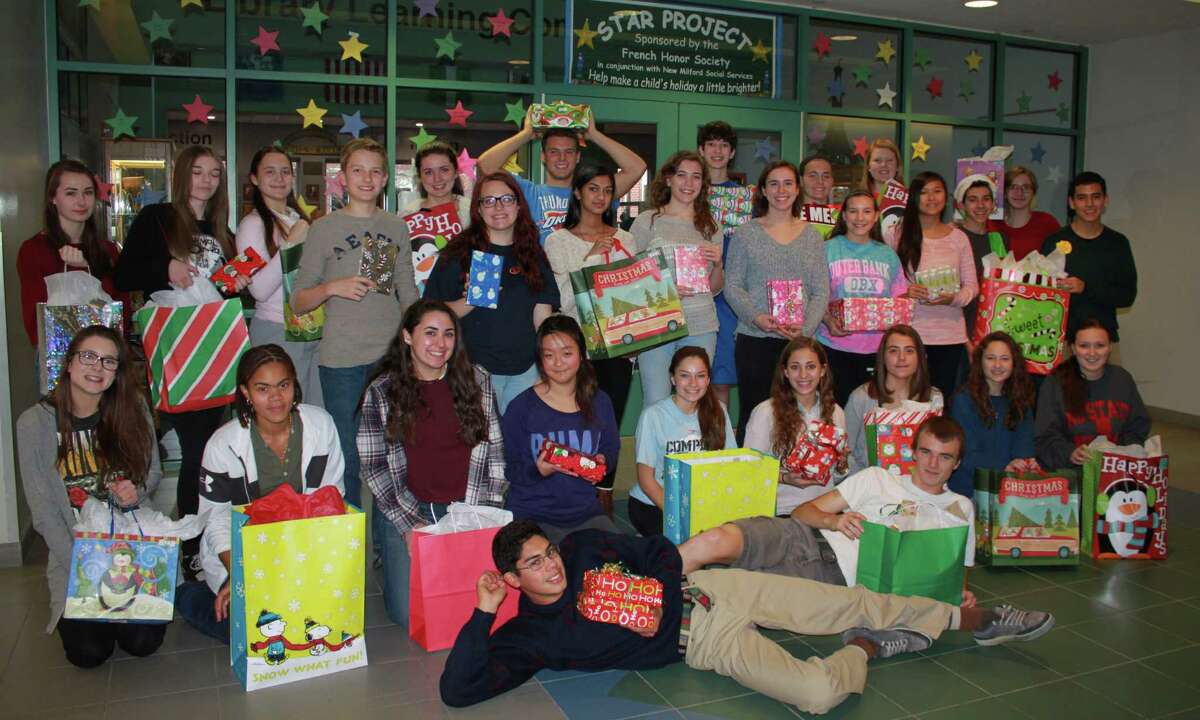 Members of New Milford High School's French Honor Society recently participated in the 15th annual Star Project to provide children in need with boots and books during the holidays. Above are, from left to right, in front, Herlandt Lino and Zack Pitcher; second row, Kailyn Schuster, Tyra Lindsay, Krystal Ferrante, Anna Qiu, Katie Grinnell, Olivia Thalassinos, Mackenzie Morehouse, Emma Hallacker and Allegra Peery; third row, Alyssa Forster, Shayna Caprio, Jennifer Kast, Dan Andreczyk, Paige Sorenson, Divanie Yamraj, Stephanie Johnson, Elizabeth Schlyer, Samantha McGuire, Francine Luo, Tyler Volansky and Cesar Gavilano; and in back, Meave Ginnane, Nate Diamond, Tyler Helmus, Raquel Morehouse, Abbie Gillin and Katie Polley.