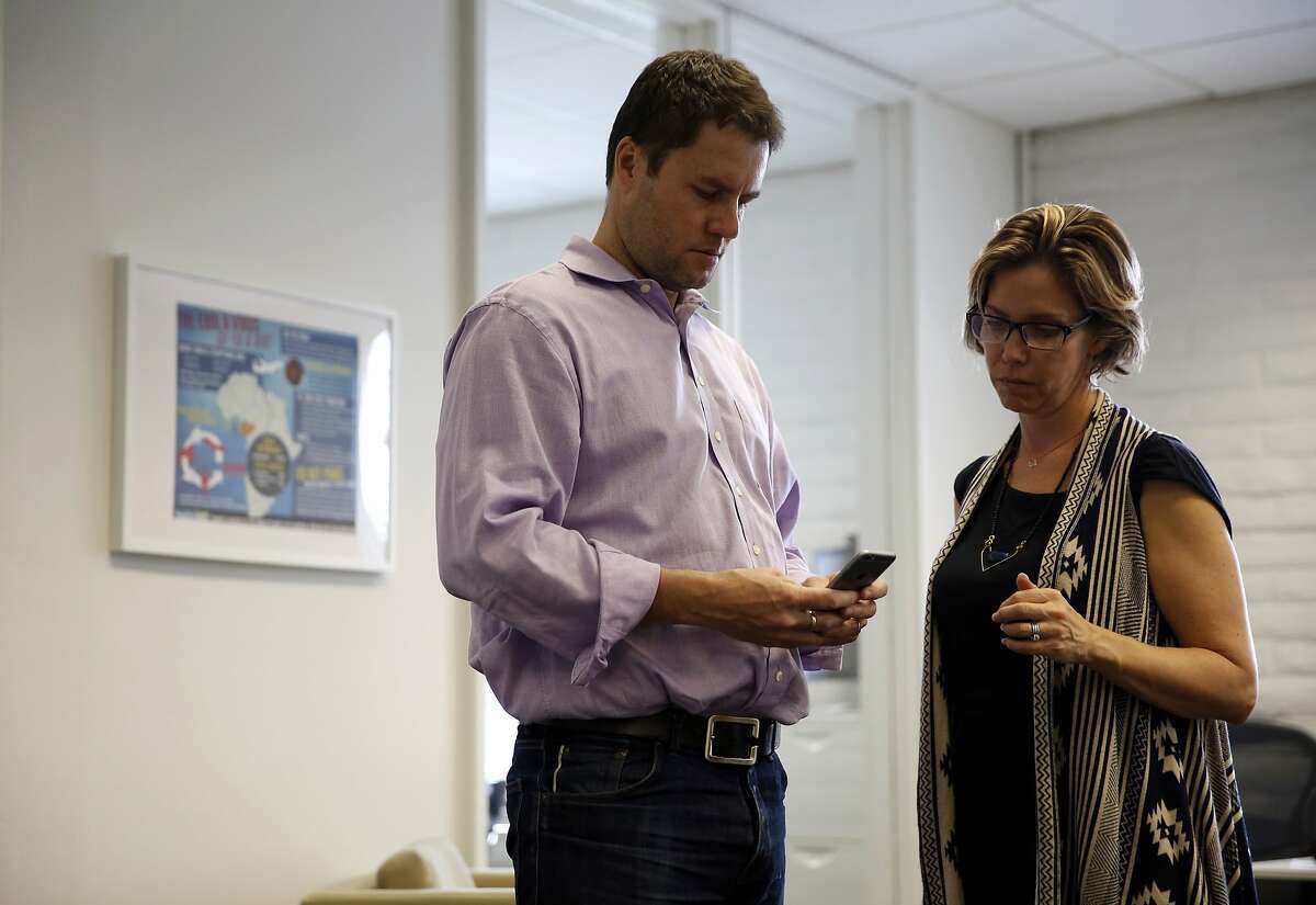 Mark Hadfield (left), CEO, and Pamela Hadfield, co-founder, work on the HelloMD mobile app at HelloMD headquarters in San Rafael, California, on Thursday, Jan. 7, 2016.