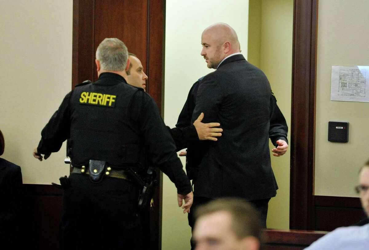 Joshua Spratt, right, is taken into custody following his sentencing at the Albany County Judicial Center on Thursday, Jan. 7, 2016, in Albany, N.Y. (Paul Buckowski / Times Union)