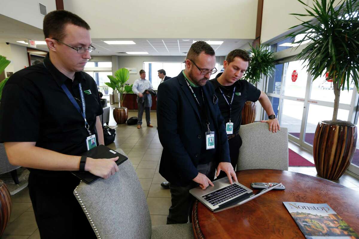 Rise pilots Ryan Weeditz, left, and Justin Williams go over flight information with Cooper Johnson at Hobby Airport. The Dallas-based air service plans to add flights to San Antonio this quarter.