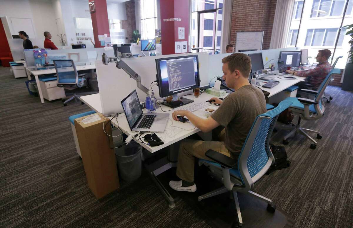 Workers on the job at the Target Technology Innovation Center office in San Francisco. A survey says millennials are saving a median of 7.5 percent of their pay.