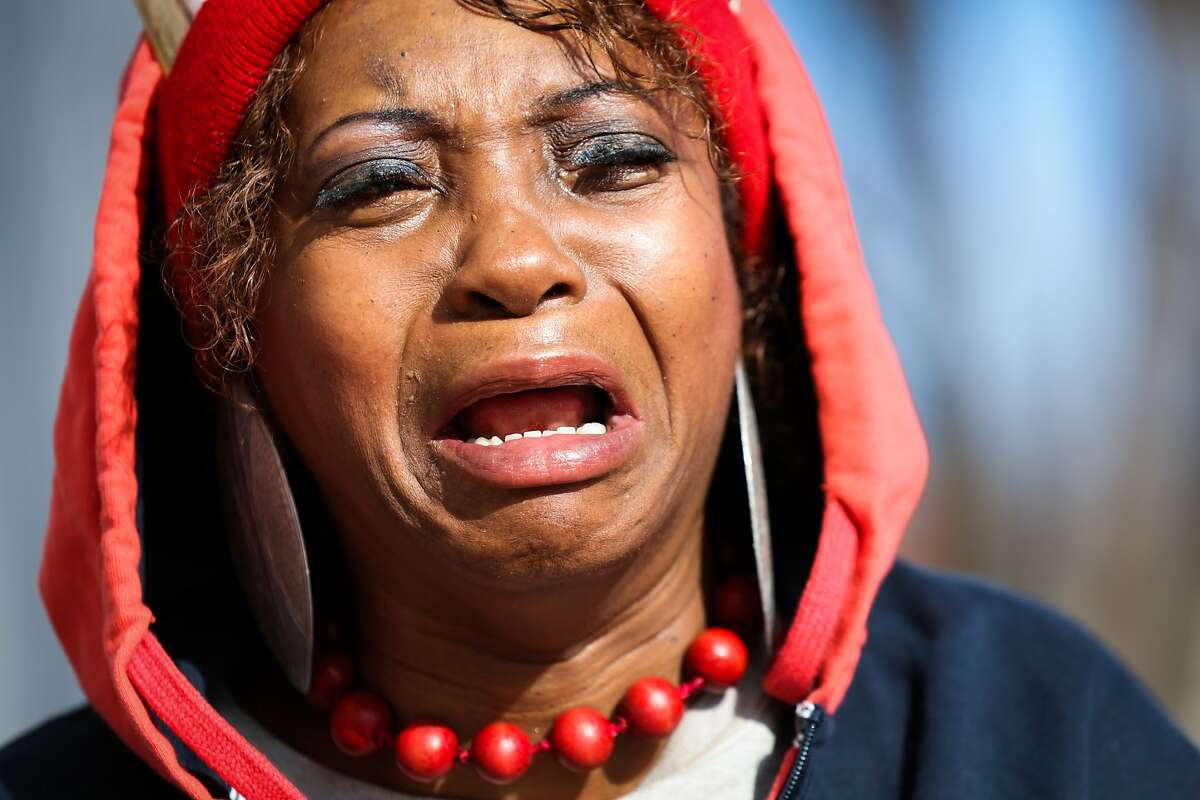 Salahaquekyah Chandler, the mother of Yalani Chinyamurindi, 19, who was killed in a quadruple homicide last year, is raw with emotion outside the Hall of Justice, after the head of the homicide unit at the district attorney's office said that there are no leads on her son's case, in San Francisco, California on Thursday, January 7, 2016.