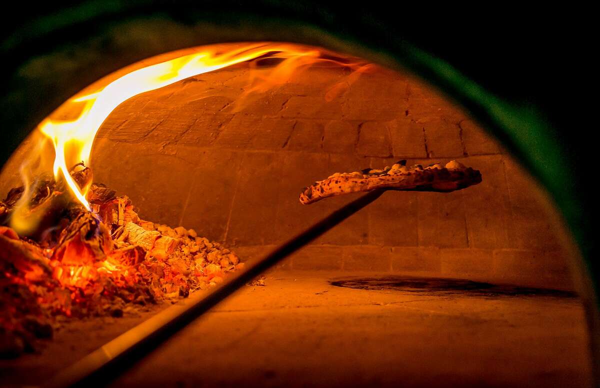 Pizza cooking in the oven at Del Popolo in San Francisco, Calif., is seen on January 7th, 2016.