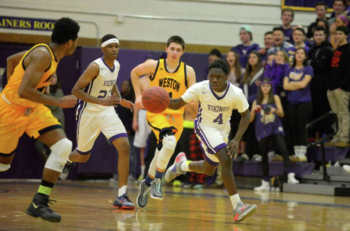 Westhill's Tarik Rivers drives the ball up court against Weston during a boys basketball game at Westhill High School in Stamford, Conn. on Jan. 7, 2016. Westhill defeated Weston 66-42.
