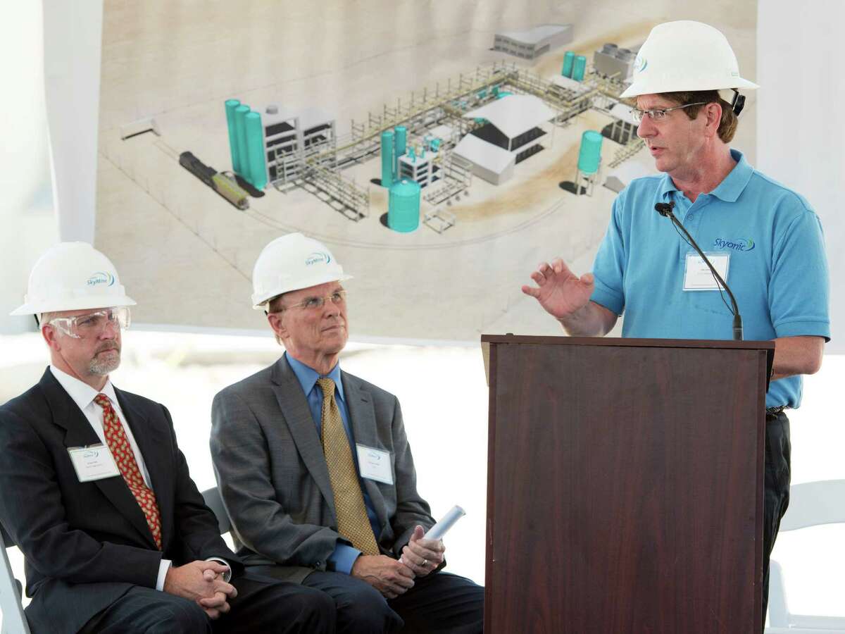 Capitol Aggregates President Greg Hale (from left) and Bexar County Judge Nelson Wolff listen as Skyonic Corp. CEO Joe Jones speaks during the 2013 groundbreaking for the plant.