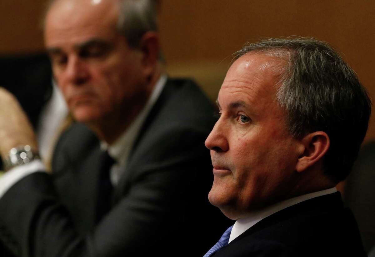 Texas Attorney General Ken Paxton, right, looks at one of special prosecutors during a pre-trial motion hearing at the Collin County courthouse on Tuesday, Dec. 1, 2015, in McKinney, Texas. The Texas Ethics Commission approved an advisory opinion Monday allowing out-of-state supporters to pay for Paxton's legal defense. (Jae S. Lee/The Dallas Morning News)