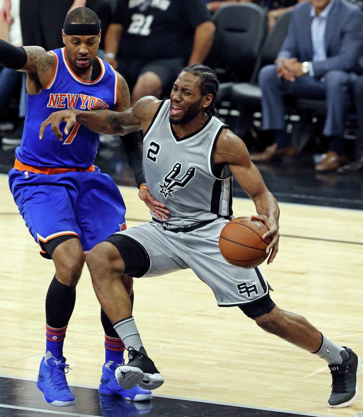 San Antonio Spurs' Kawhi Leonard looks for room around New York Knicks' Carmelo Anthony during first half action Friday Jan. 8, 2016 at the AT&T Center.