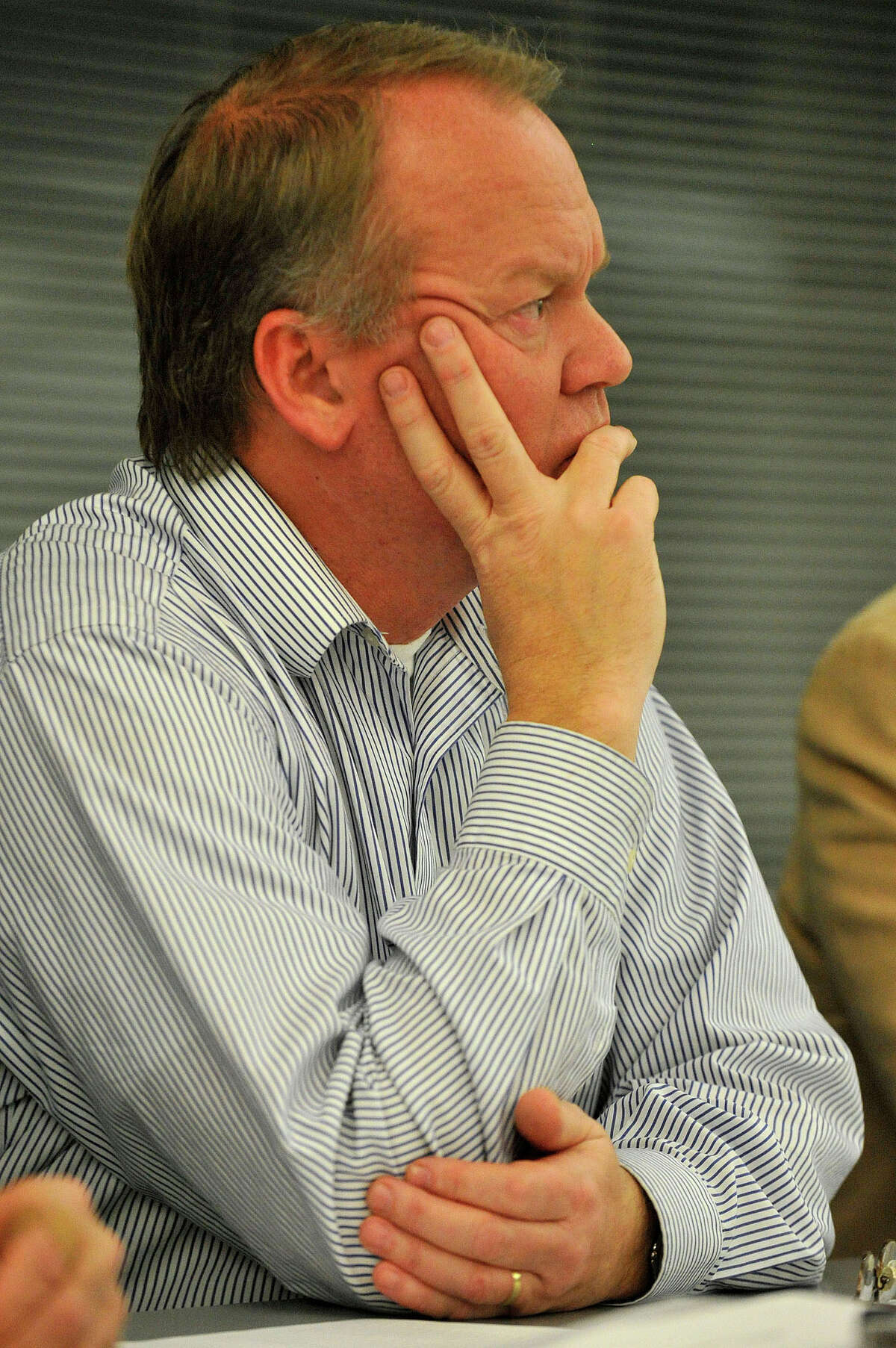Chairman of the Zoning Board Tom Mills listens to public comments during the public hearing in front of the Zoning Board on the proposed redevelopment of the Stamford train station parking garage at the Stamford Government Center in Stamford, Conn., on Nov. 24, 2014. The state Department of Transportation picked John McClutchy to develop the current train station parking garage into a $500 million, 1 million square feet mixed-use property. Many speakers were concerned about the low number of spaces, safety and the distance commuters must travel from their parking spaces to the train platform.