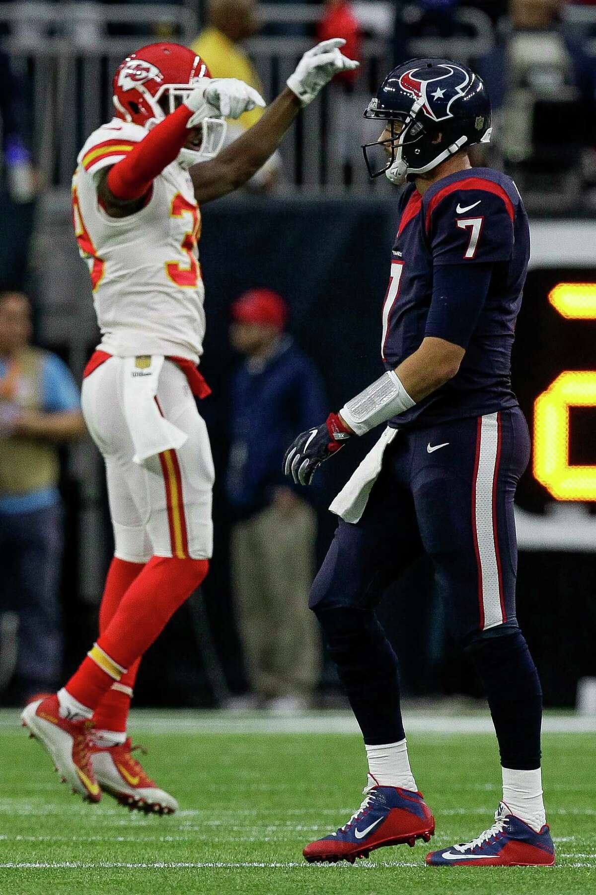 ﻿Chiefs free safety Husain Abdullah, left, celebrates a fumble recovery in the first quarter - one of Texans quarterback Brian Hoyer's five turnovers during Saturday's 30-0 blowout.﻿