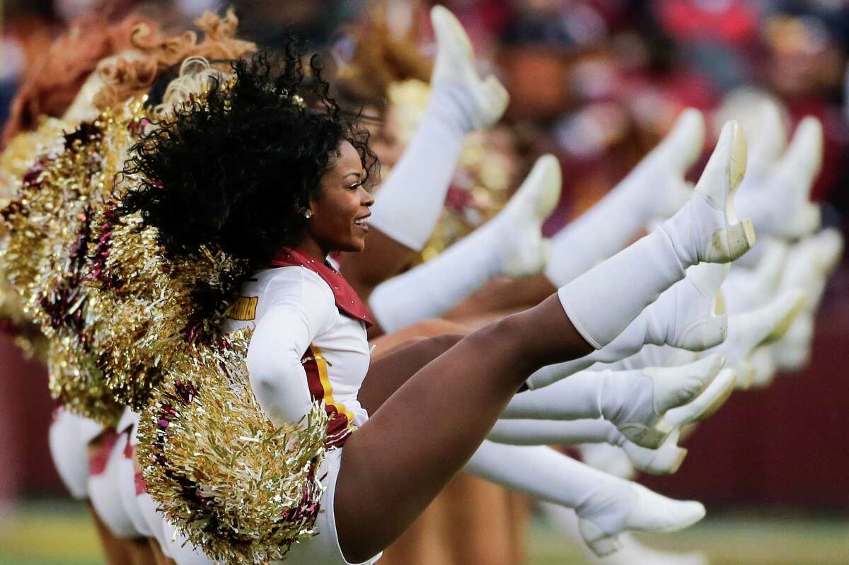 The Washington Redskins cheerleaders perform before an NFL wild card playoff football game against the Green Bay Packers in Landover, Md., Sunday, Jan. 10, 2016. (AP Photo/Mark Tenally)