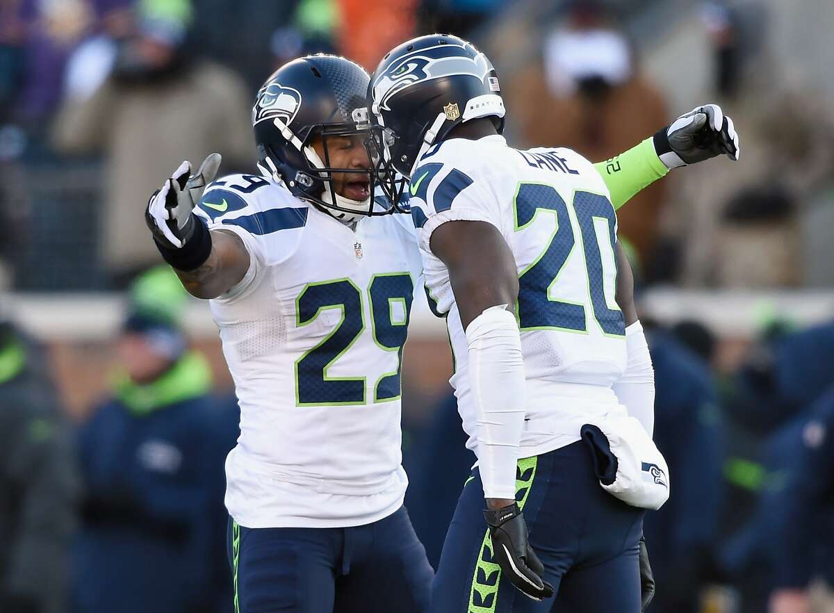 MINNEAPOLIS, MN - JANUARY 10: Earl Thomas #29 of the Seattle Seahawks and Jeremy Lane #20 celebrate after Lane broke up a pass in the fourth quarter against the Minnesota Vikings during the NFC Wild Card Playoff game at TCFBank Stadium on January 10, 2016 in Minneapolis, Minnesota. (Photo by Hannah Foslien/Getty Images)