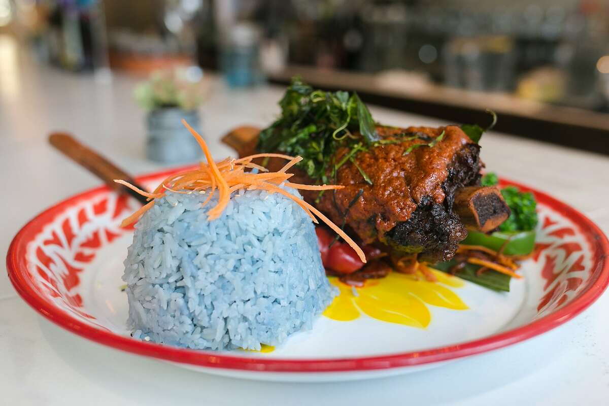 Panang Neua, beef short rib ($22), which is served with blue rice, at Farmhouse Kitchen in the Mission District.