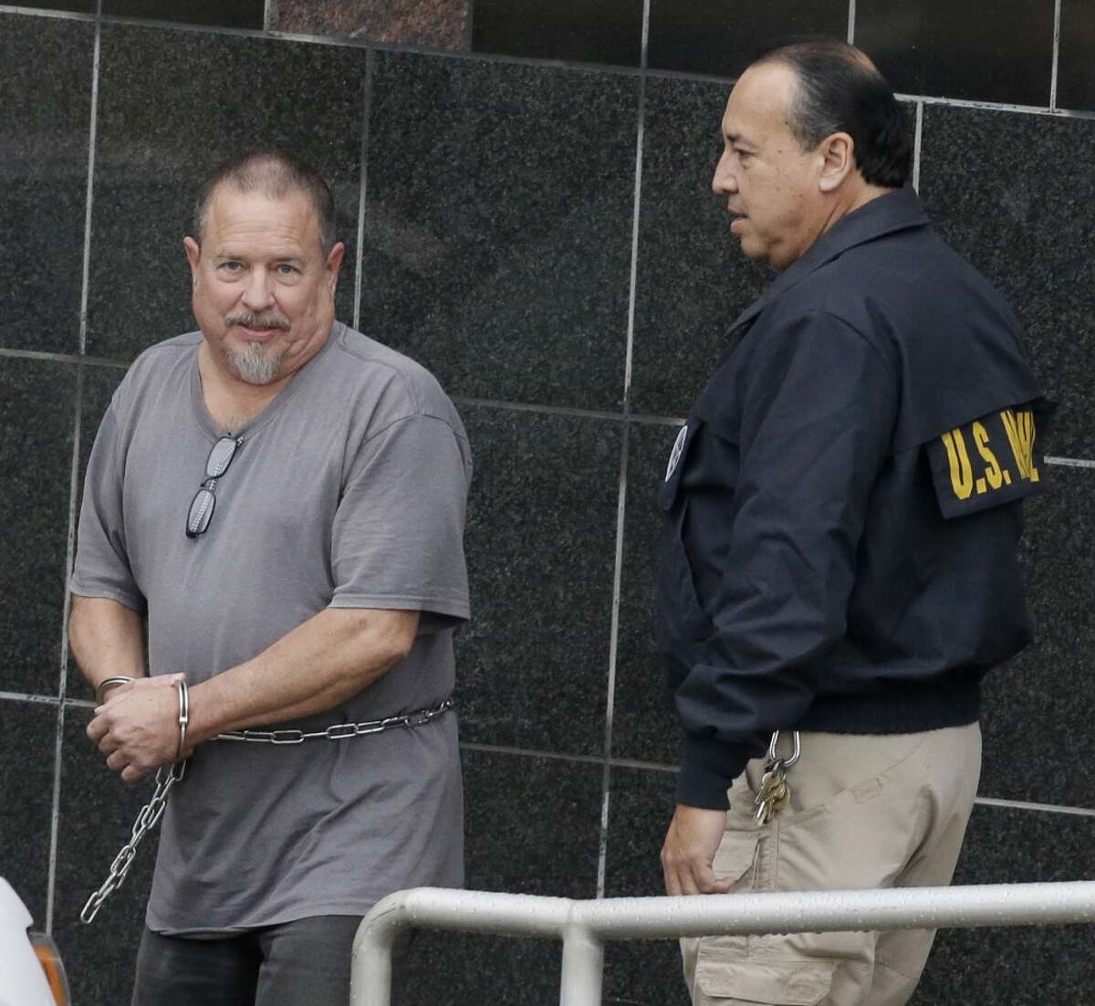 Jeffrey Fay Pike, 60, of Conroe, the national president of the Bandidos Motorcycle Club, is escorted from the Bob Casey Federal Courthouse, 515 Rusk, after an appearance in federal court, where he faced several charges related to his alleged activity with the Bandidos Motorcycle Club shown Wednesday, Jan. 6, 2016, in Houston. ( Melissa Phillip / Houston Chronicle ) Jeffrey Ray Pike is escorted by a U. S. Marshal after an appearance in federal court, where he faced several charges related to his alleged activity with the Bandidos Motorcycle Club Wednesday, Jan. 6, 2016, in Houston. ( Melissa Phillip / Houston Chronicle )