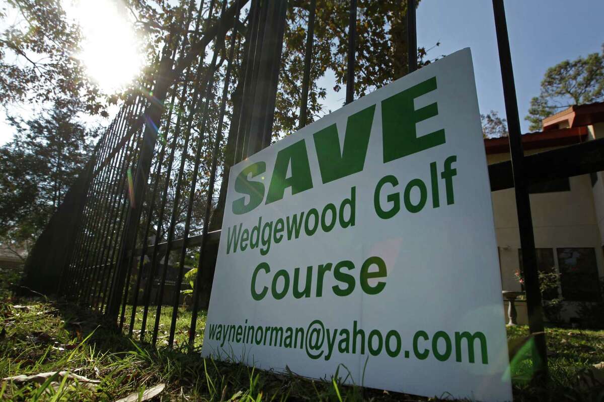 A sign is shown in a yard along the Wedgewood Golf Course, 5454 TX-105, Tuesday, Dec. 8, 2015, in Conroe. The course which has been around some 30 years, but is now about to close. Some residents of the area want to buy it and keep it as a golf course. Otherwise, the bank could sell it to developers and the homeowners worry that would cause them to lose value on their homes. ( Melissa Phillip / Houston Chronicle )