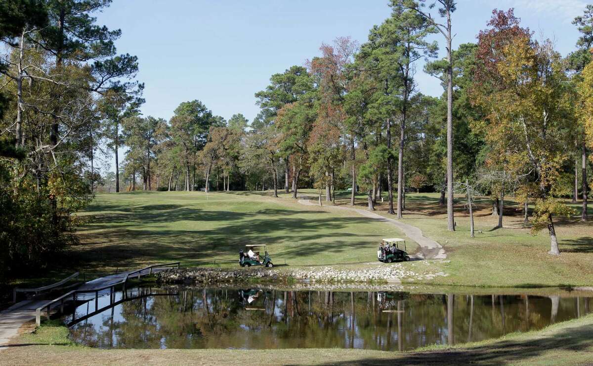 Golfers play at Wedgewood Golf Course, 5454 TX-105, Tuesday, Dec. 8, 2015, in Conroe. The course which has been around some 30 years, but is now about to close. Some residents of the area want to buy it and keep it as a golf course. Otherwise, the bank could sell it to developers and the homeowners worry that would cause them to lose value on their homes. ( Melissa Phillip / Houston Chronicle )