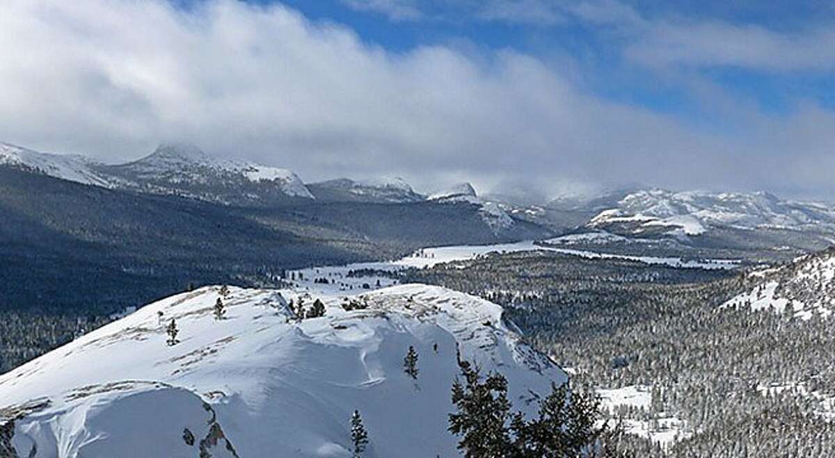 9,449-foot Lembert Dome, with Tuolumne Meadows in the background, where 24 inches of snow last week has compressed and brought the snow pack here up to four feet across the high country for miles, with higher amounts on wind-driven slabs