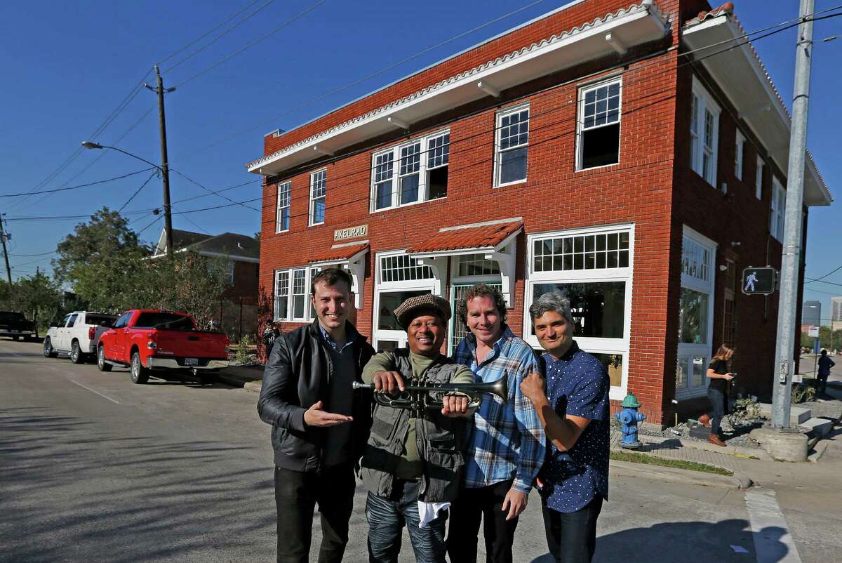 Axelrad owners Jeff Kaplan, (left-right), Kermit Ruffins, Adam Brackman, Monte Large and Jeff Kaplan pose for a portrait Monday, Nov. 23, 2015, in Houston. A grocery store more than a century ago, the Axelrad building on Alabama was in disrepair and seemingly set for demolition. But a team of developers -- Monte Large, Adam Brackman and Jeff Kaplan -- decided to turn the space into a large beer garden that reflects the multi-cultural neighborhoods that border it: the Third Ward, Midtown, Montrose and the Museum District. They also plan to bring a bit of New Orleans culture. After Hurricane Katrina flooded the city, numerous NOLA musicians evacuated to Houston. Kaplan and Brackman opened their homes to several and helped some find work performing in Houston. Among them is the legendary Kermit Ruffins, a trumpeter and vocalist beloved in New Orleans. Ruffins is a partner in the Axelrad project and he'll perform there weekly. ( Steve Gonzales / Houston Chronicle )