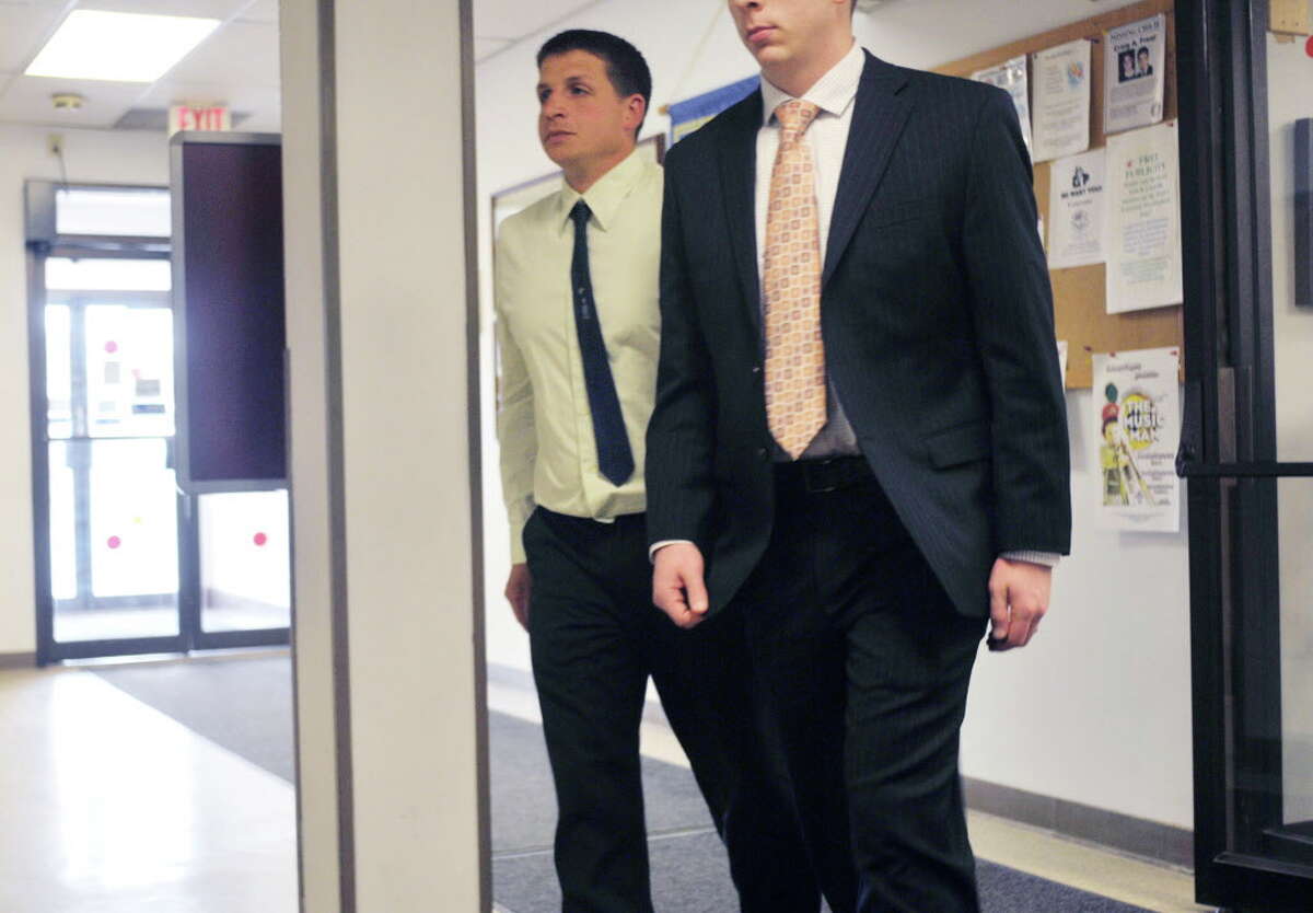 Joshua Rockwood, left, walks back into Glenville Town Court with his lawyer on Monday, April 27, 2015, in Glenville, N.Y. Rockwood, who had his horses seized for alleged neglect, was at court for a hearing on the case. (Paul Buckowski / Times Union)