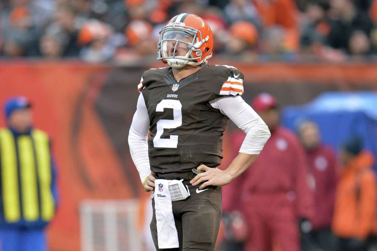 FILE - In this Dec. 14, 2014, file photo, Cleveland Browns quarterback Johnny Manziel reacts after being sacked in the third quarter of an NFL football game against the Cincinnati Bengals, in Cleveland. Troubled Browns quarterback Johnny Manziel was cited for driving with expired license plates last weekend. According to police in North Olmsted, Ohio, Manziel was stopped at 8:28 a.m. on Saturday, Jan. 3, 2016, while driving on Interstate 480 (AP Photo/David Richard, File)