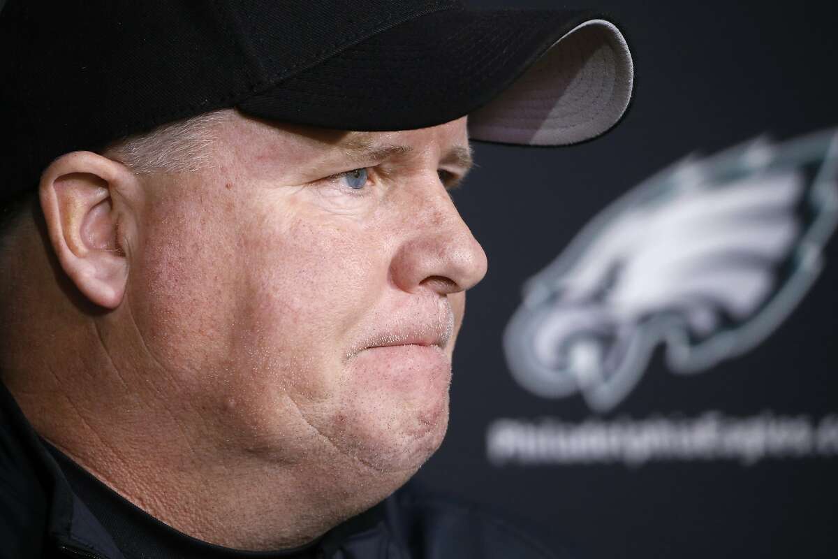 In this Monday, Dec. 28, 2015 photo, Philadelphia Eagles head coach Chip Kelly listens to a question during a news conference at the NFL football team's practice facility in Philadelphia. 