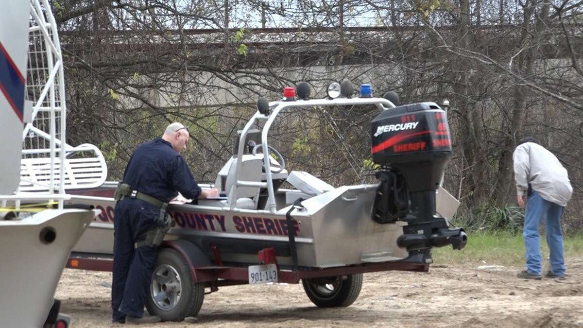 Crews worked to recover a dead body along the San Jacinto River on Thursday.