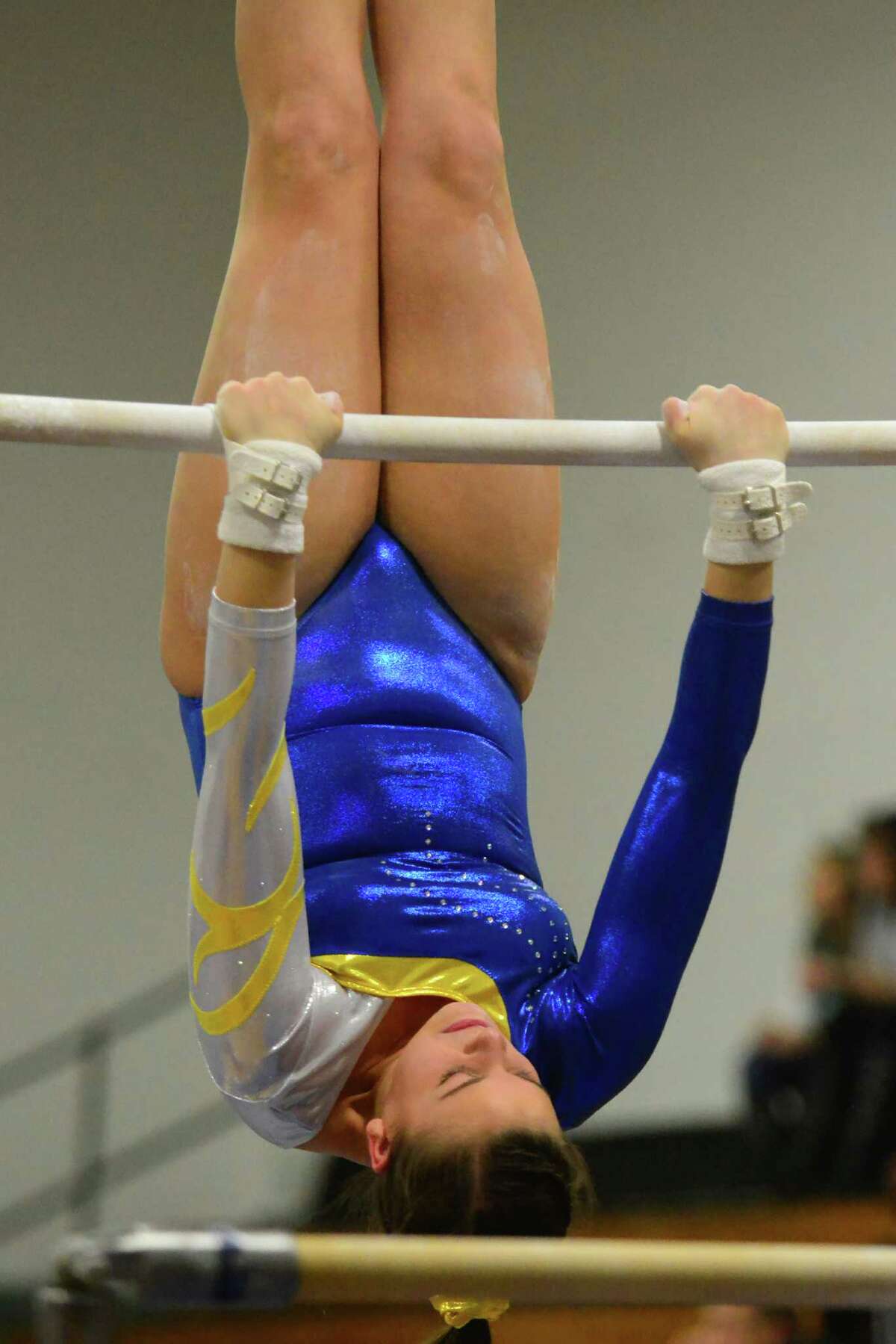 Newtown's Maddie Jannott competes on the uneven bars during gymnastics competition between Jonathan Law, Daniel Hand and Oxford Thursday at Jonathan Law in Milford. Jannott competed as an indvidual.