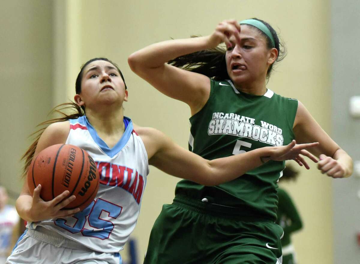 Sandy Ramirez (35) of Antonian drives for a layup as Sophia Ramos (5) of Incarnate Word gives chase during TAPPS girls high school basketball action at the Alamo Convocation Center on Thursday, Jan. 14, 2016.