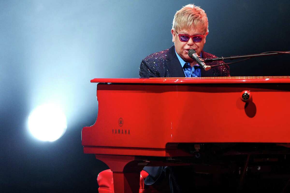 FILE - In this Wednesday, Jan. 13, 2016 file photo, Elton John performs at The Wiltern in Los Angeles. John didn't just premiere tracks from his new album at his most recent concert, he offered a tribute to his late friend David Bowie. About halfway through John's performance Wednesday night, he shared a story about Bowie, who died earlier this week. (Photo by Rich Fury/Invision/AP, File) ORG XMIT: CAET862
