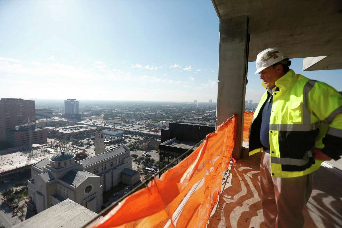 Construction manager Michael Healy is at the top of SkyHouse Main, which is expected to open in the summer. There are 17 SkyHouse apartment communities in the U.S.