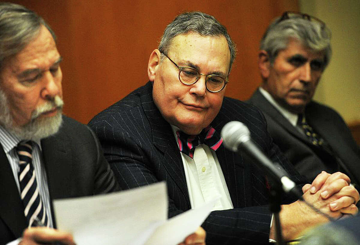 Former U.S. Attorney H. James Pickerstein of Fairfield, center, with his lawyers Andrew Bowman, left, and William Dow during a 2014 court appearance, has pleaded guilty to stealing more than $600,000 from a convicted Danbury mobster.