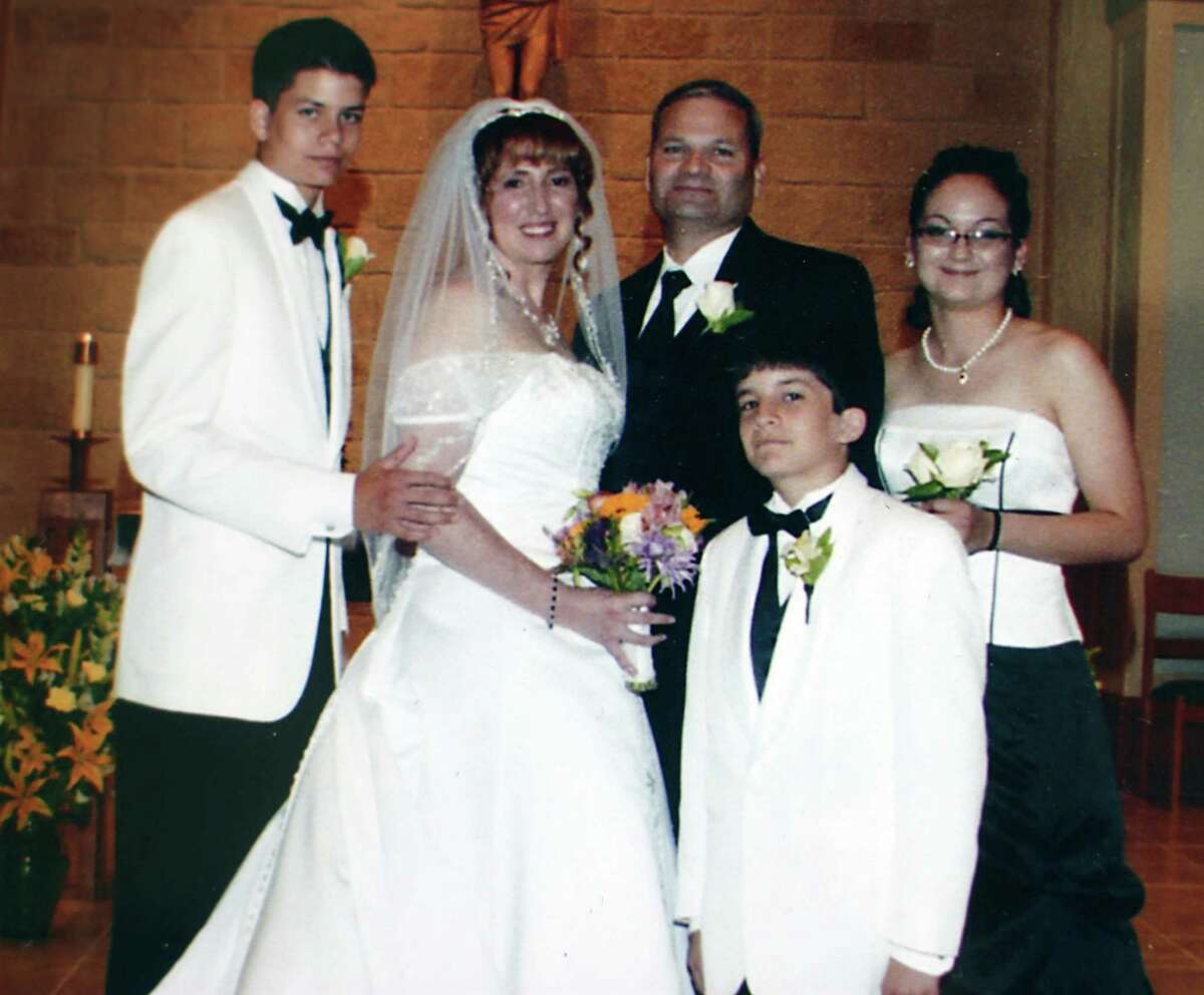 Bexar County sheriff deputy Sgt. Kenneth Vann is seen with his three children, and his bride, Yvonne, at their June 14, 2008 wedding. Bexar County sheriff deputy Sgt. Kenneth Vann was killed May 28, 2011 when a vehicle pulled next to his marked patrol car at a red light at the intersection of Rigsby Avenue and SE Loop 410 on the city's East Side and opened fire with no warning with an apparent semi automatic weapon, officials said.