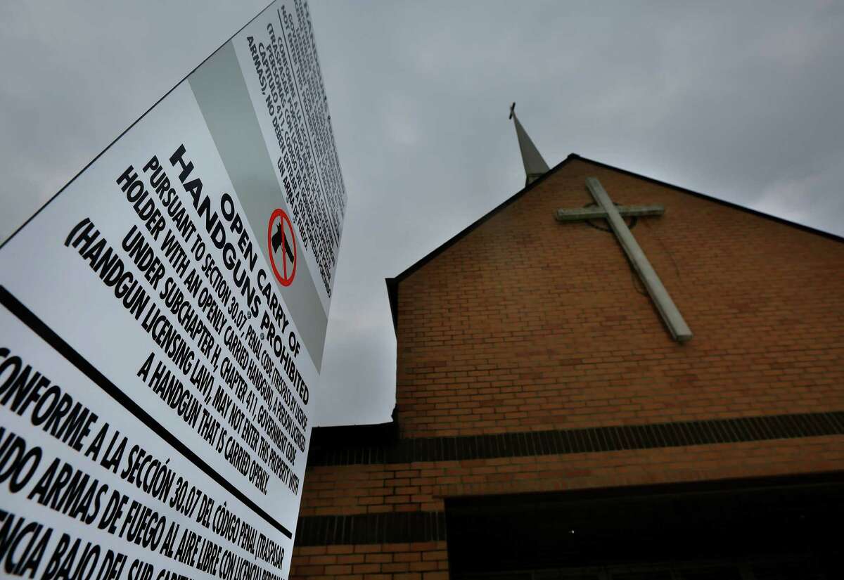 A sign erected in front of the North Main Church of God in Christ in Houston alerts members and visitors that open carry of handguns is prohibited. (Mark Mulligan / Houston Chronicle )