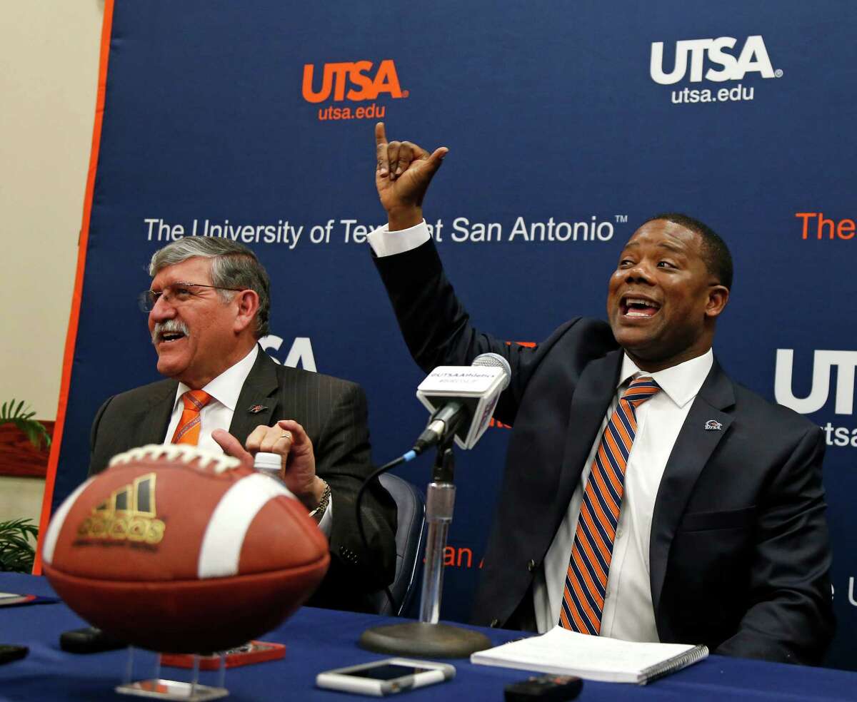 New UTSA football coach Frank Wilson and President Richard Romo are given instruction by football players in back to learn the proper way to give "Birds Up". New UTSA football coach Frank Wilson, formerly the running backs coach and recruiting coordinator for LSU. UTSA present Ricardo Romo and athletic director Lynn Hickey will be in attendance on Friday, January 15, 2016 at H.E.B. University Center.