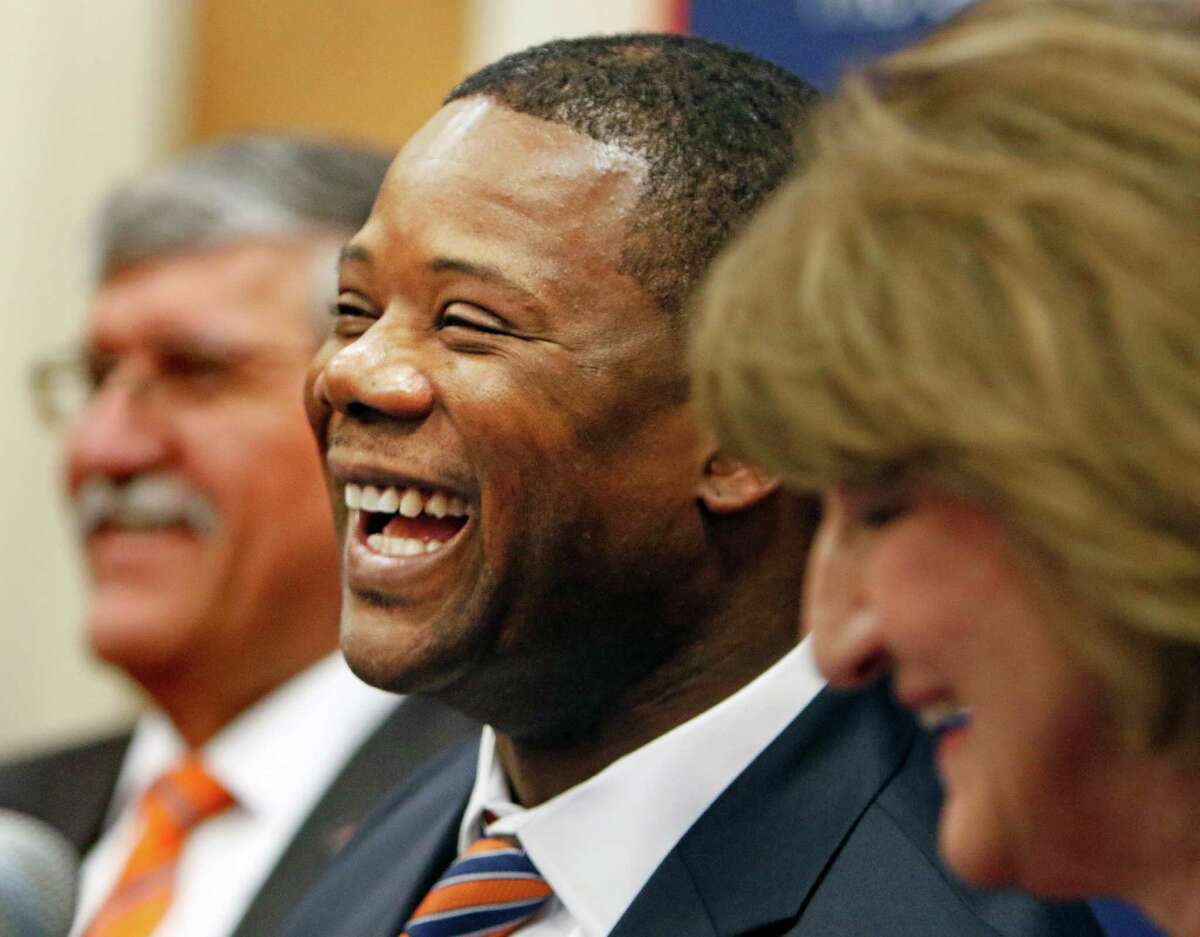 New head coach Frank Wilson,C, shares a light moment with President Richard Romo,L, and Athletic director Lynn Hickey. New UTSA football coach Frank Wilson, formerly the running backs coach and recruiting coordinator for LSU. UTSA present Ricardo Romo and athletic director Lynn Hickey will be in attendance on Friday, January 15, 2016 at H.E.B. University Center.