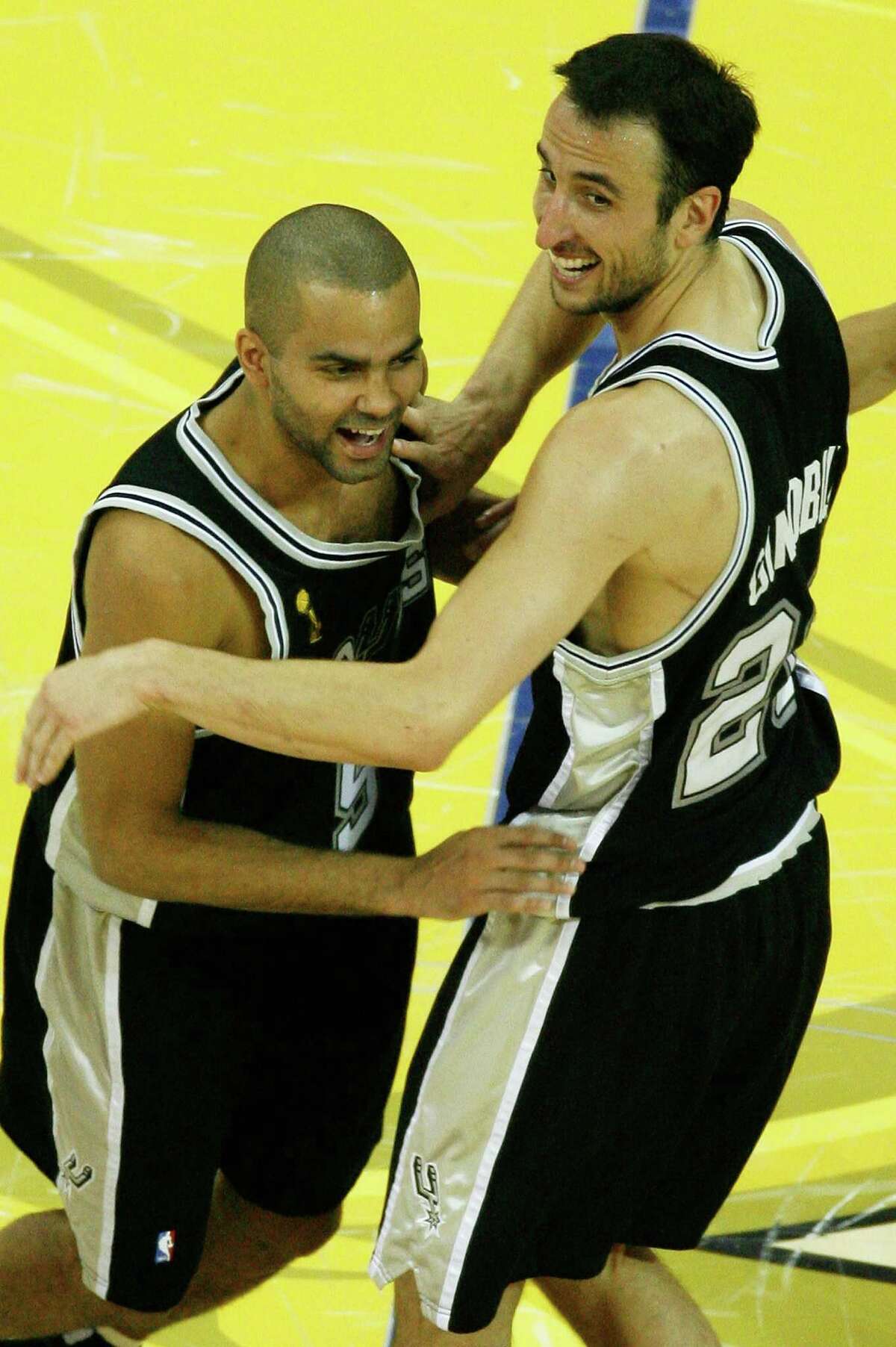 Manu Ginobili #20 and Tony Parker #9 of the San Antonio Spurs celebrate their 83-82 victory over the Cleveland Cavaliers to win Game Four of the NBA Finals on June 14, 2007 at the Quicken Loans Arena in Cleveland, Ohio. NOTE TO USER: User expressly acknowledges and agrees that, by downloading and or using this photograph, User is consenting to the terms and conditions of the Getty Images License Agreement. (Photo by Gregory Shamus/Getty Images)