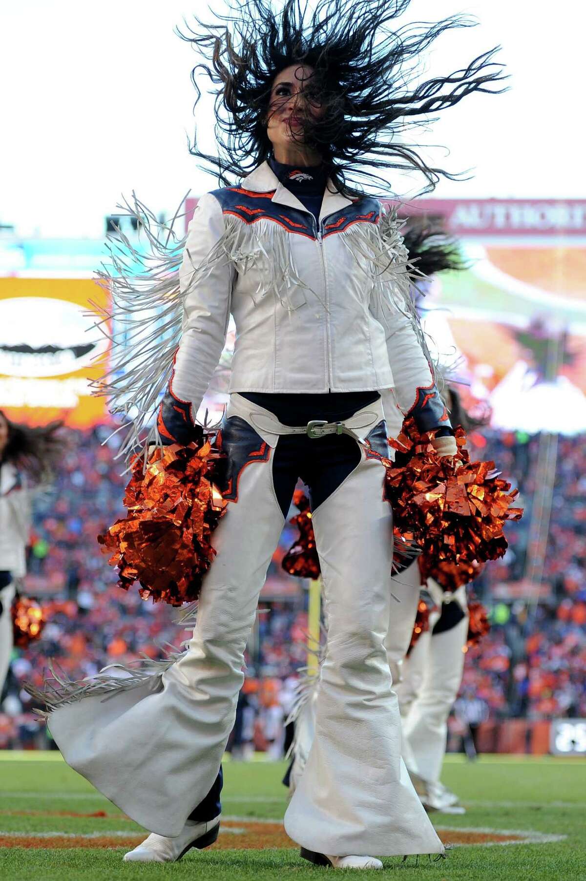 A Arizona Cardinals cheerleader performs against the Arizona