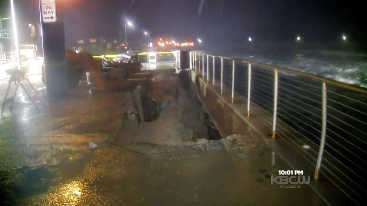 Waves pounded the shore and eroded the ground beneath of a stretch of sidewalk along Beach Boulevard in Pacifica, Calif. on Sunday Jan 17, 2016.