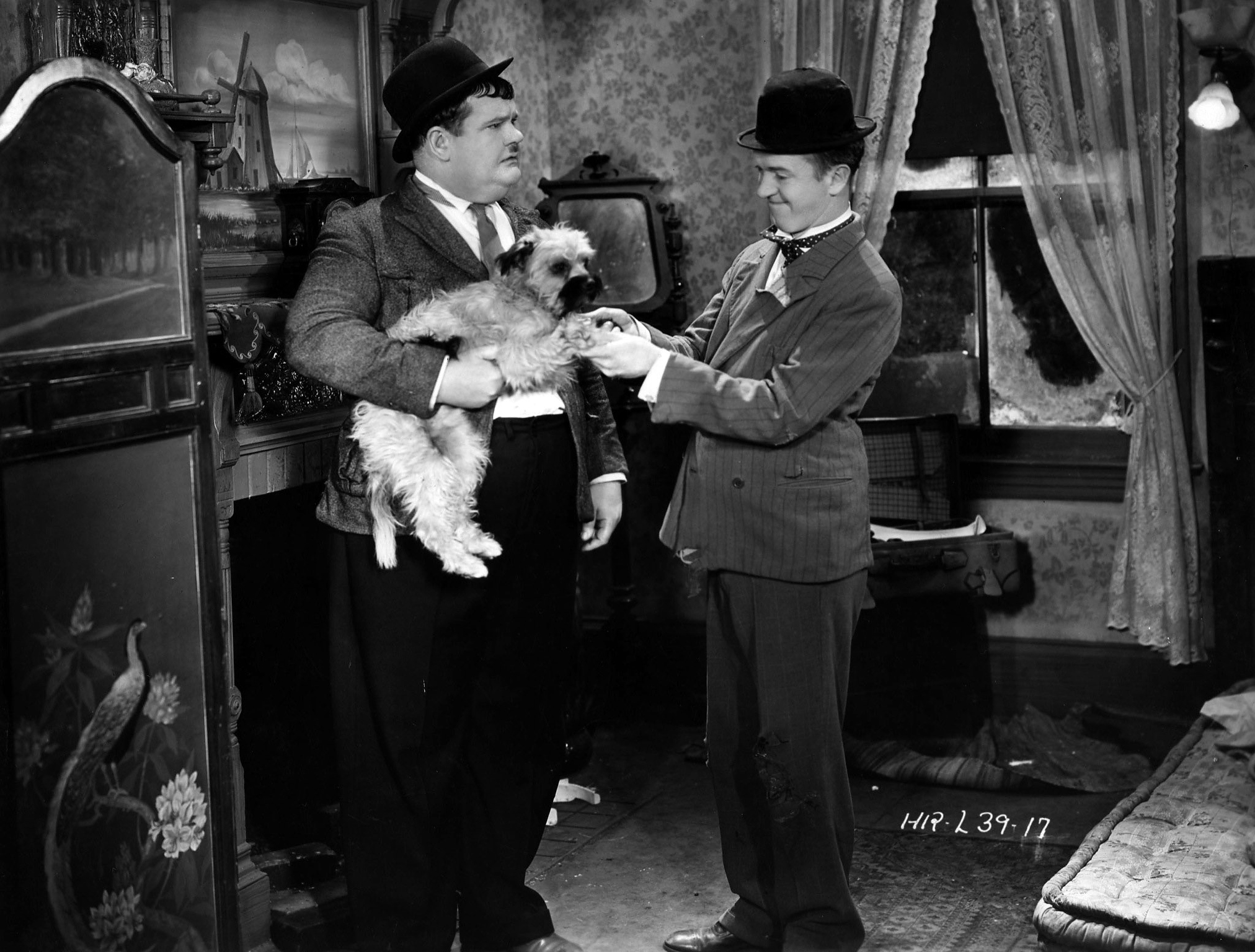 Stan Laurel and Oliver Hardy star in the Hal Roach the 1931 film 'Laughing Gravy', in which the disastrous duo become involved with a small mongrel. The film was directed by James W Horne.