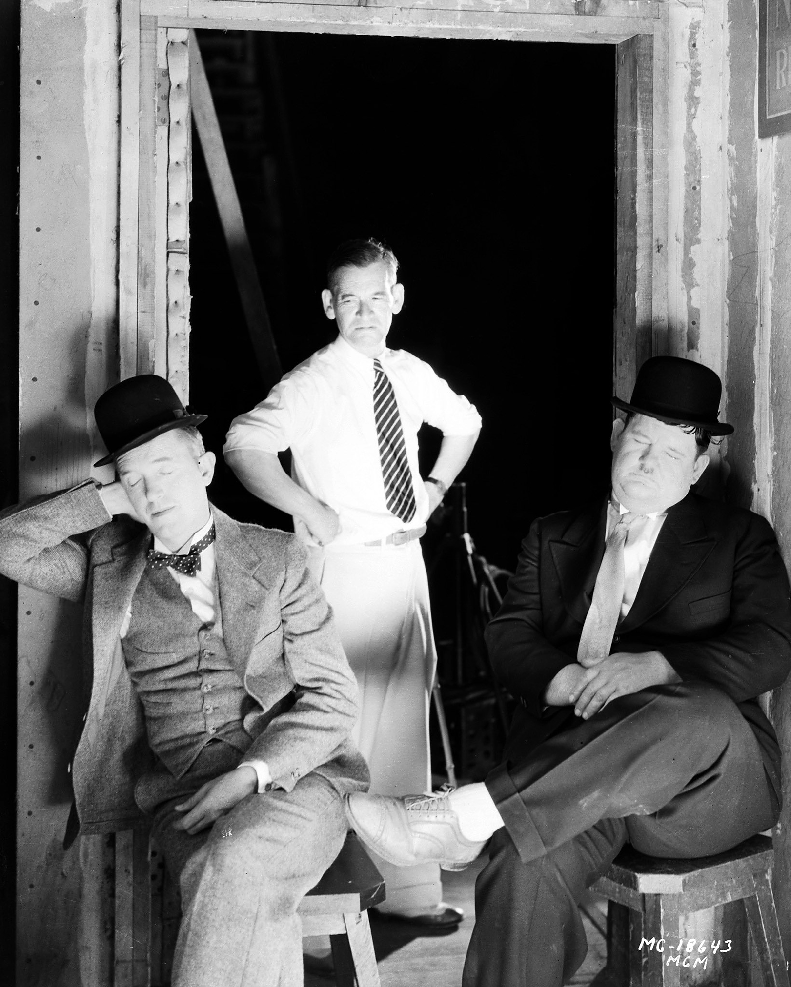 Comic double-act Stan Laurel and Oliver Hardy are caught sleeping on the job by director James W Horne, 1930.