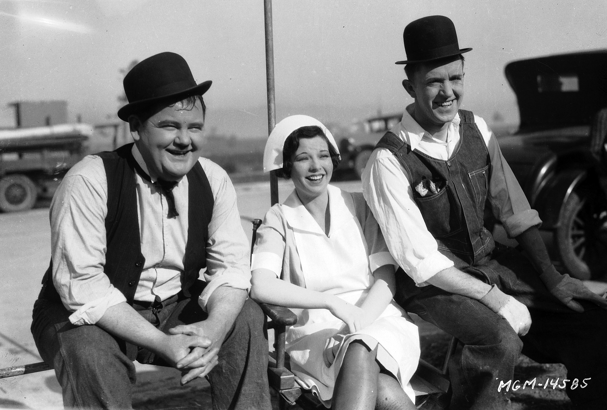 Oliver Hardy and Stan Laurel with Dorothy Coburn during the filming of 'The Finishing Touch', directed by Leo McCarey and Clyde Bruckman, 1928.