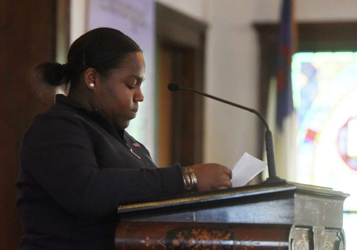 Shauntel Hylton, 17, recites her speech during the Fourth Annual the Rev. Dr. Martin Luther King Jr. Oratorical Contest at First Baptist Church in Greenwich, Conn. Monday, Jan. 18, 2016. Participants responded to Dr. King's statement "A riot is the language of the unheard," relating that quote to the context of today's society.