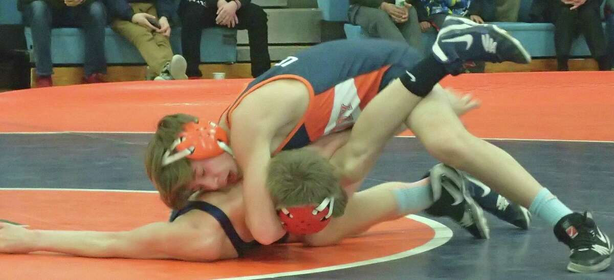 Danbury High School freshman Ben LeBlanc, top, won a 6-1 decision over Mount Anthony Union's Tyson Sauer in the 106-pound match, final match of the meet Monday. The Hatters won, 34-23, their first win over Mount Anthony since 2012.