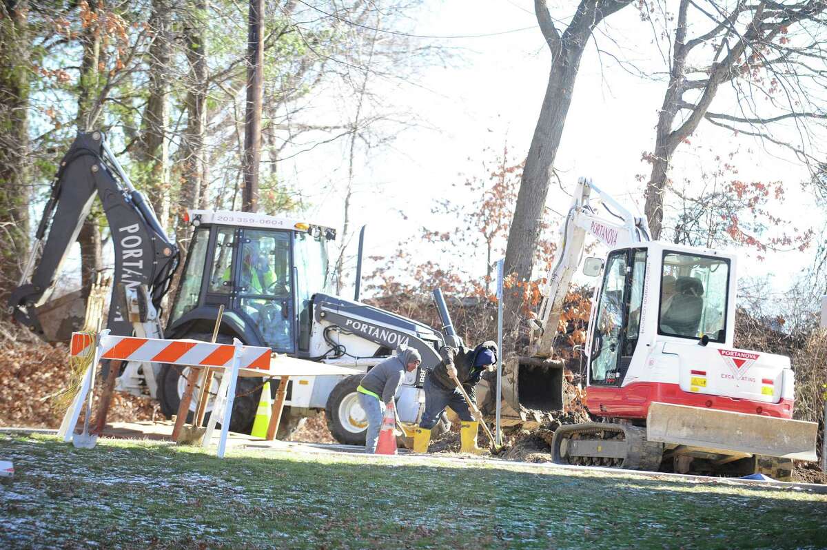 Workers repair a broken water main at Turn of River Middle School on Tuesday, Jan. 19, 2016. The school lost all water but remained open for the day.