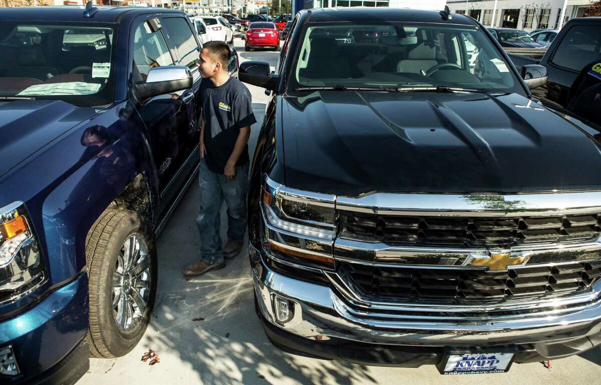New trucks at Knapp Chevrolet in Houston earlier this year. Across the region, sales are down 22 percent from last year. ( Brett Coomer / Houston Chronicle )