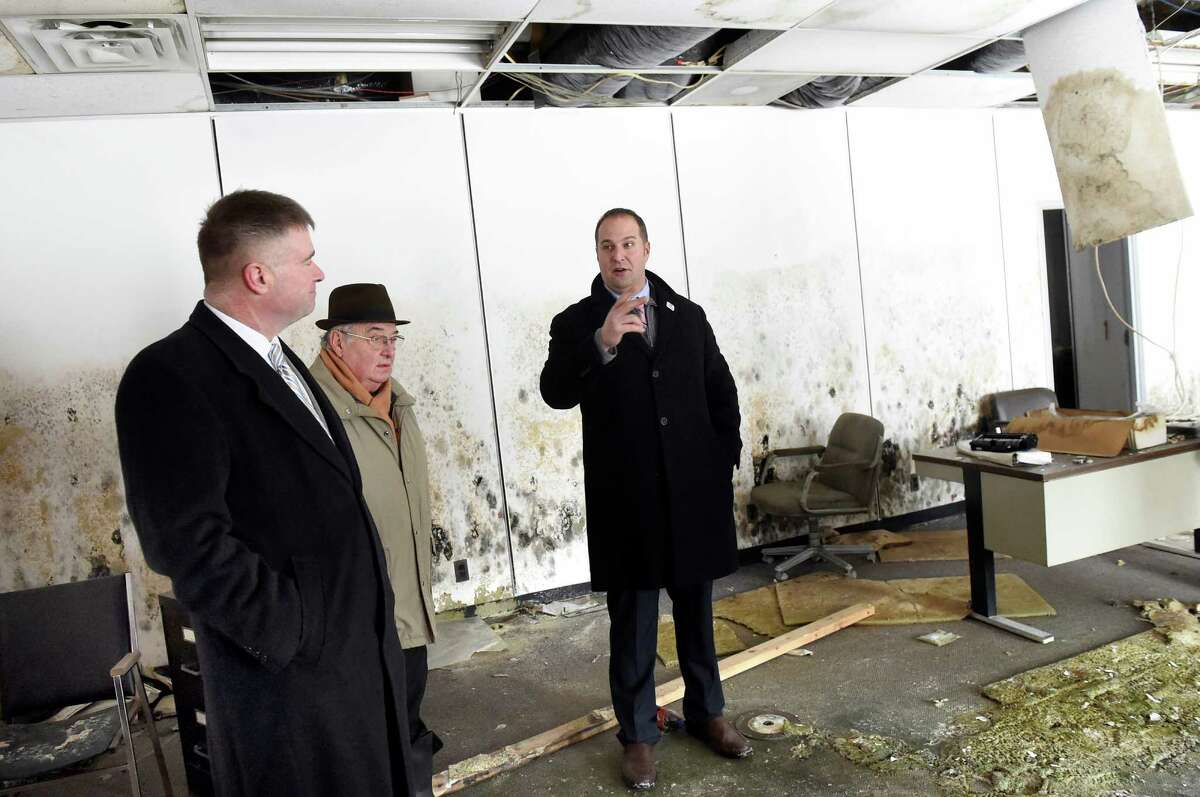 Montgomery County Executive Matt Ossenfort, right, speaks during a tour of the former Beech-Nut plant with Rep. Chris Gibson, left, and Mayor Francis Avery on Tuesday, Jan. 19, 2016, in Canajoharie, N.Y. (Cindy Schultz / Times Union)
