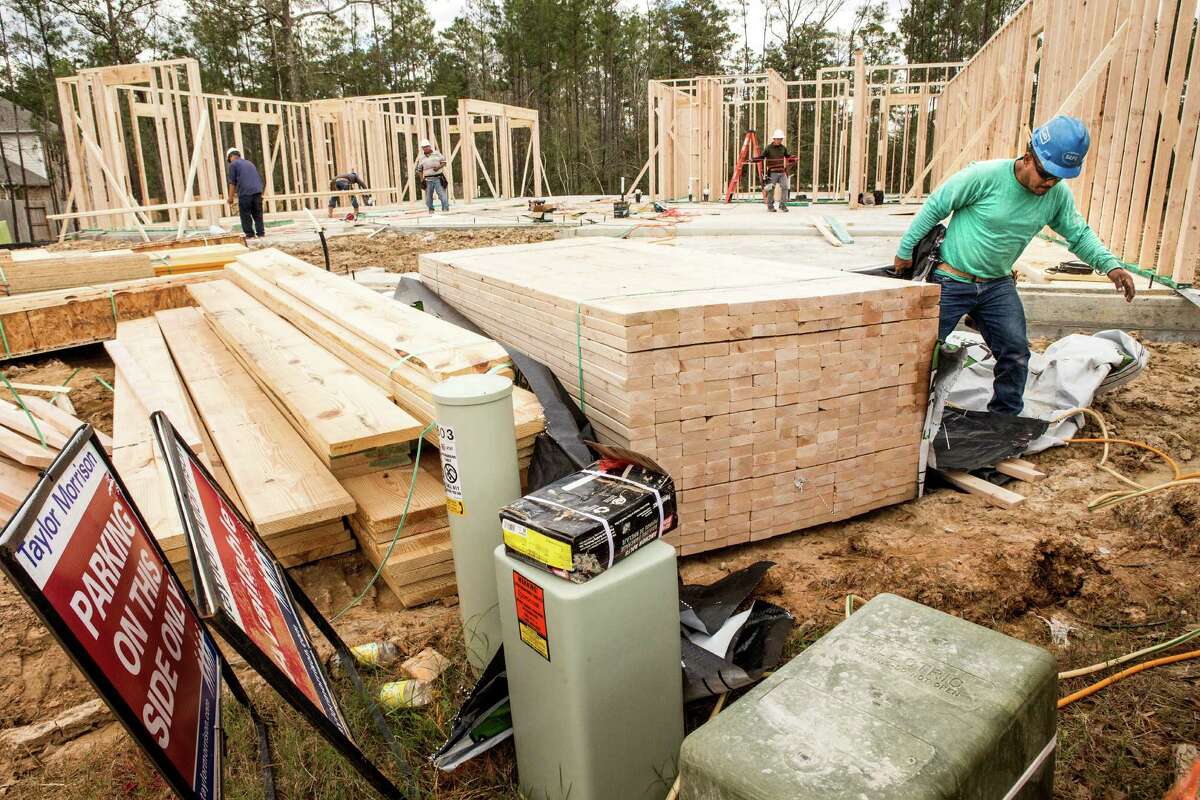 New homes are under construction in the Springwoods Village subdivision, a new master-planned community near the Exxon Mobil campus, on Tuesday, Jan. 19, 2016, in Spring. ( Brett Coomer / Houston Chronicle )