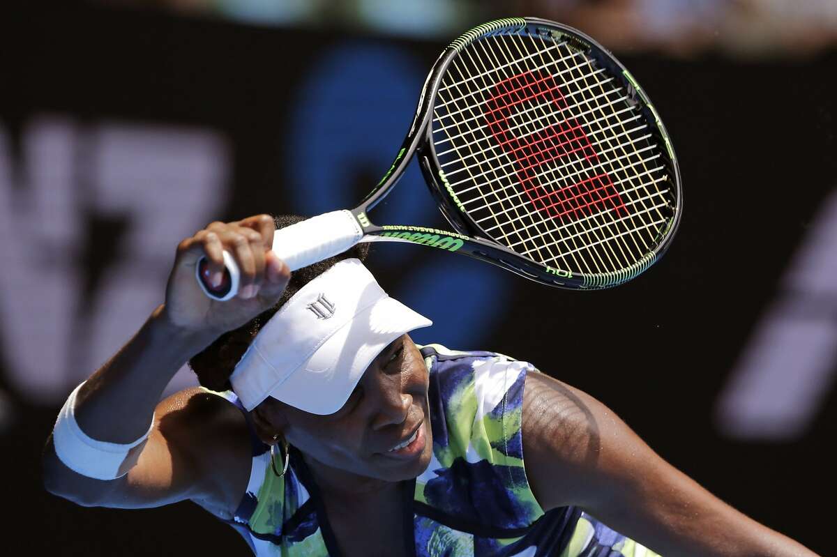 Venus Williams of the United States hits a forehand return to Johanna Konta of Britain during their first round match at the Australian Open tennis championships in Melbourne, Australia, Tuesday, Jan. 19, 2016.(AP Photo/Aaron Favila)