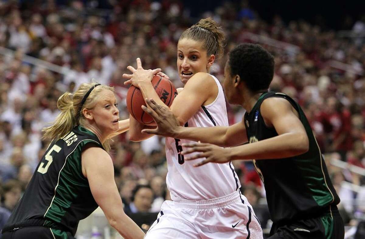 SAN ANTONIO - APRIL 04: Guard Caroline Doty #5 of the Connecticut Huskies is pressured by Melissa Jones #5 and Shanay Washington #15 of the Baylor Bears during the Women's Final Four Semifinals at the Alamodome on April 4, 2010 in San Antonio, Texas. (Photo by Ronald Martinez/Getty Images) *** Local Caption *** Caroline Doty;Shanay Washington;Melissa Jones