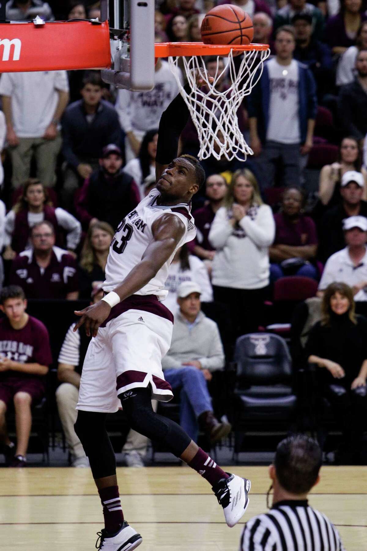 Texas A&M Aggies guard Danuel House (23) dunks the ball as Texas A&M takes on LSU Tuesday, Jan. 19, 2016, in College Station.
